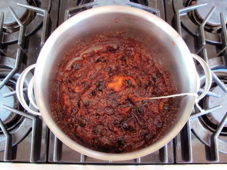 Fig preserves simmering in a stockpot.