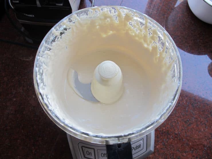 Preparing tahini sauce in a food processor.