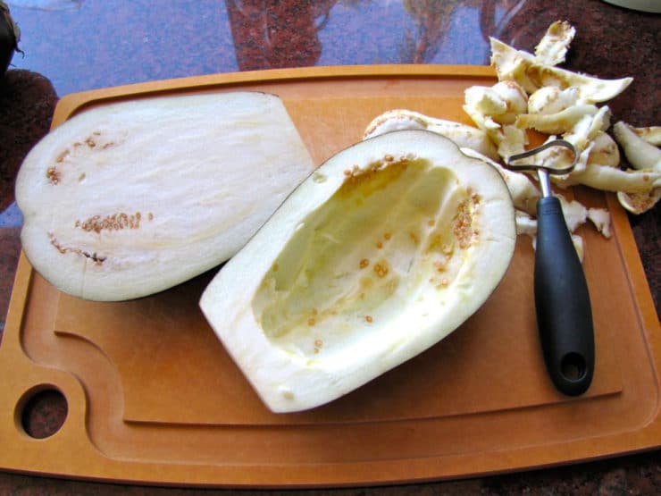 Scooping out centers of eggplant halves.