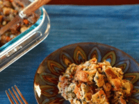 Challah Chestnut Stuffing on a plate with a fork on the side