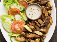 Discover how to make juicy, flavorful chicken shawarma at home using a homemade spice blend, and cook it either in the oven or on the grill!