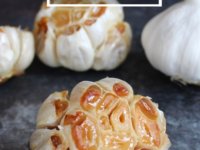 Set of roast garlic on a countertop close-up