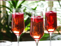 Raspberry Moscato Cocktail serve on three fancy glasses with Raspberry garnish on top